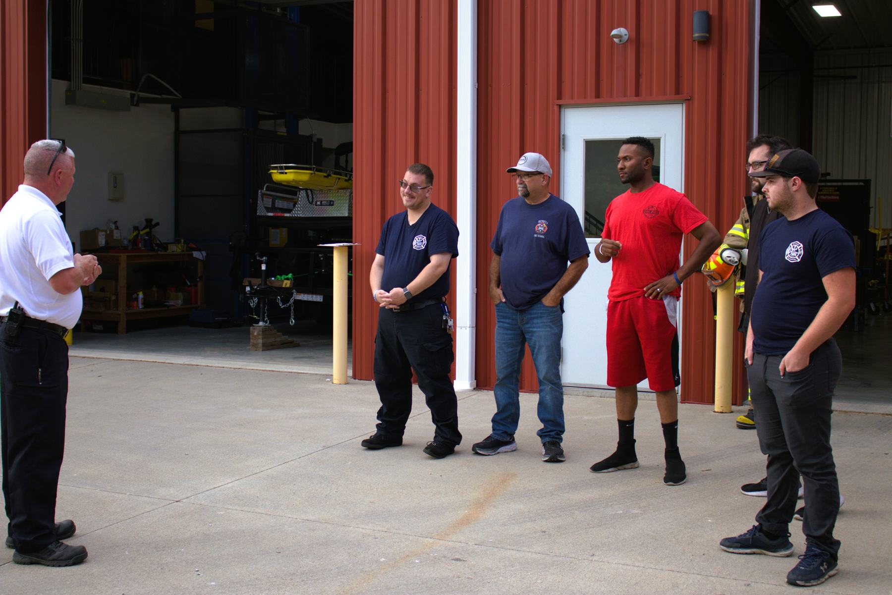 Wea Township firefighters gathered at the station bay doors
